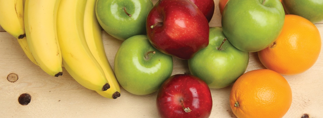 Assorted fresh fruit on wood.