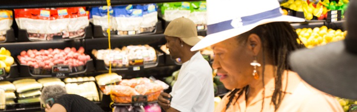 Photo of customers shopping in the produce dept.